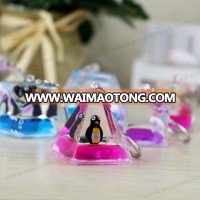 pyramid shape liquid floating keyring aqua keychain with 3D penguin floaters