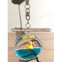 cheap cute duck floater round liquid keychain aqua oil keyring